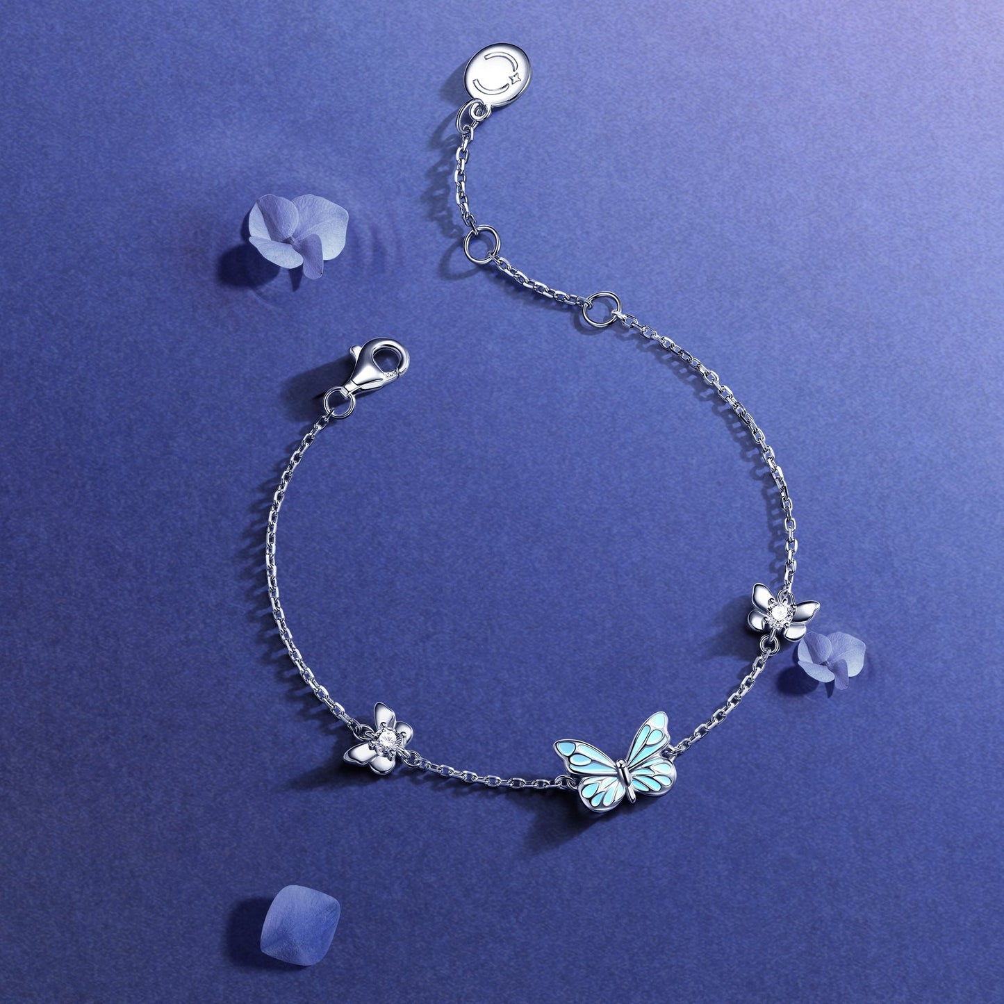Close-up of luminous enamel butterfly charm detail