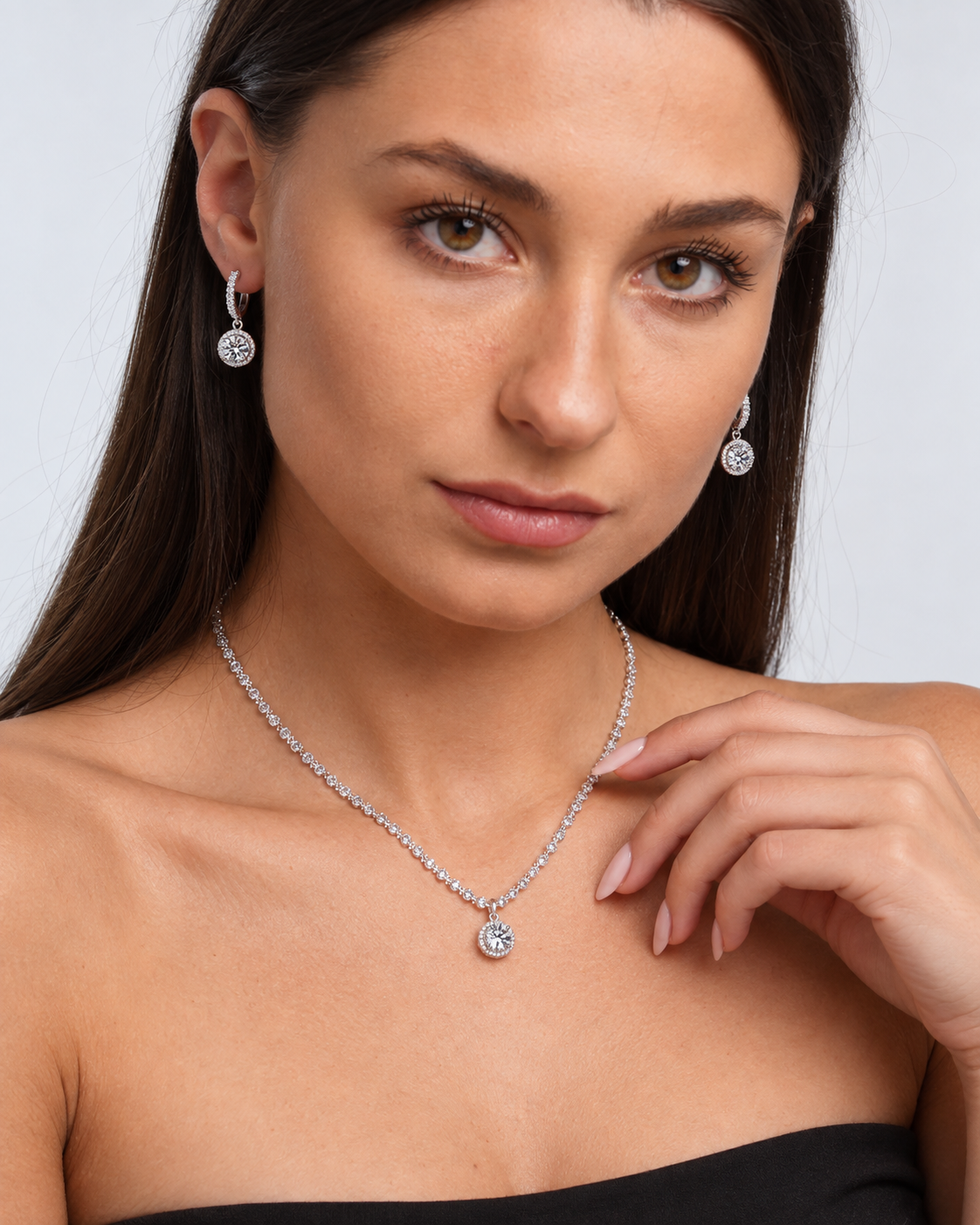 925 Sterling Silver Round Crystal Necklace & Earring Set in Clear, worn by a model in a close-up - Vessaly