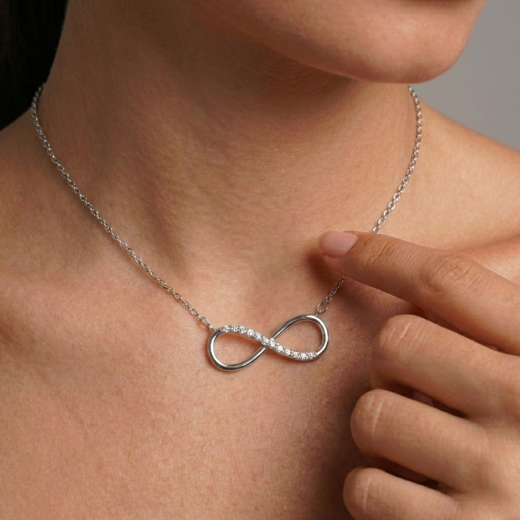 Close-up of silver infinity pavé pendant – Vessaly