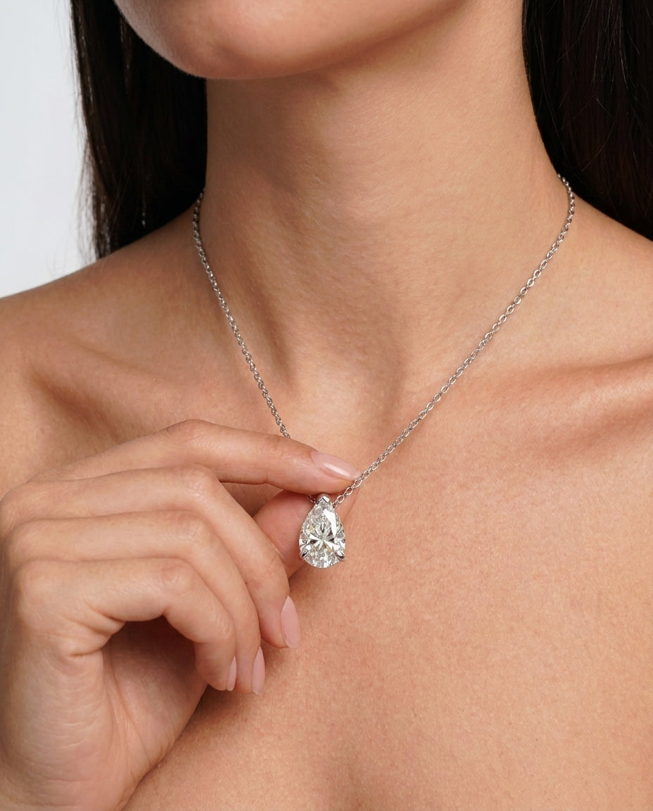 Pear-cut moissanite necklace styled on neckline – Vessaly