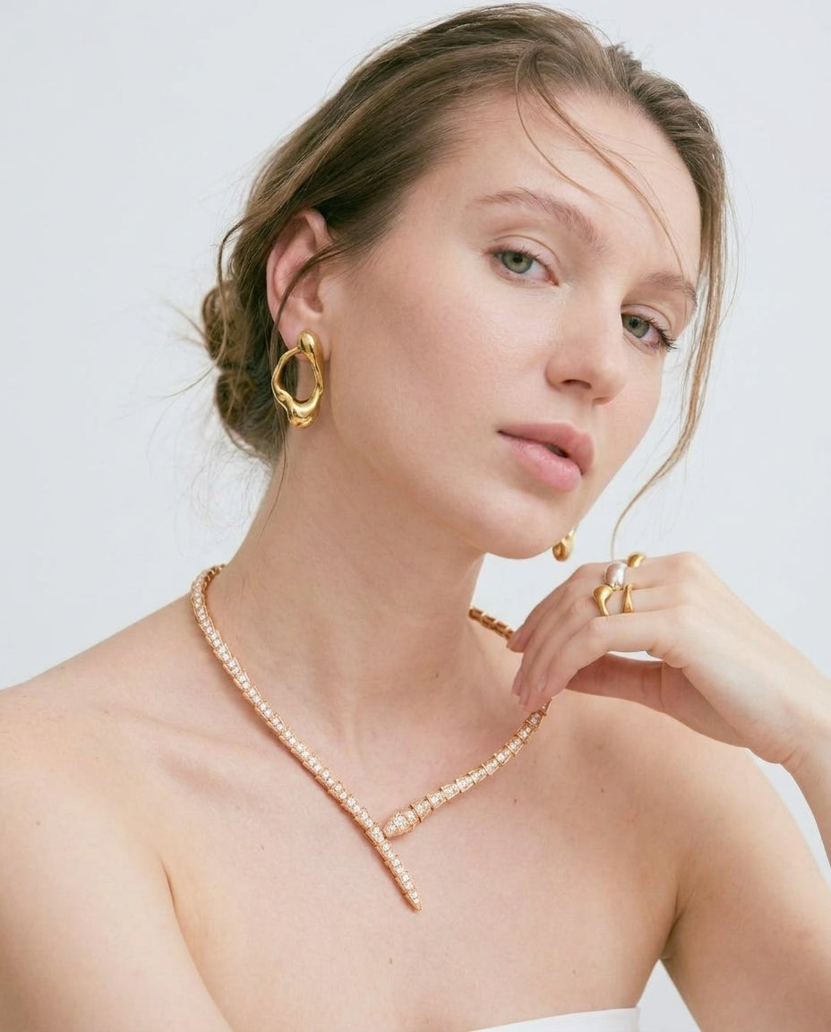 Gold serpent choker necklace styled on neckline – Vessaly