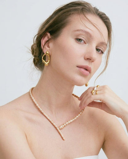Gold serpent choker necklace styled on neckline – Vessaly
