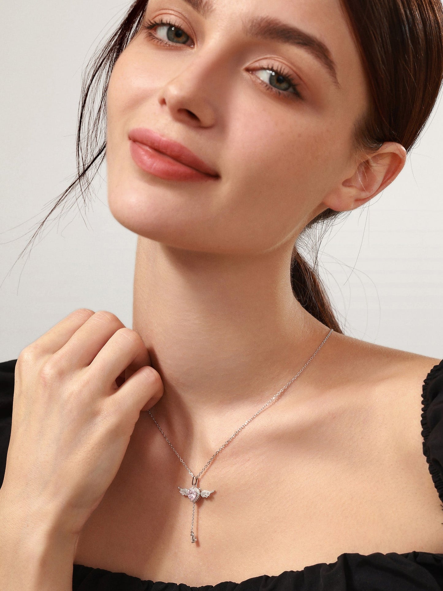 Sterling silver angel necklace, side angle view