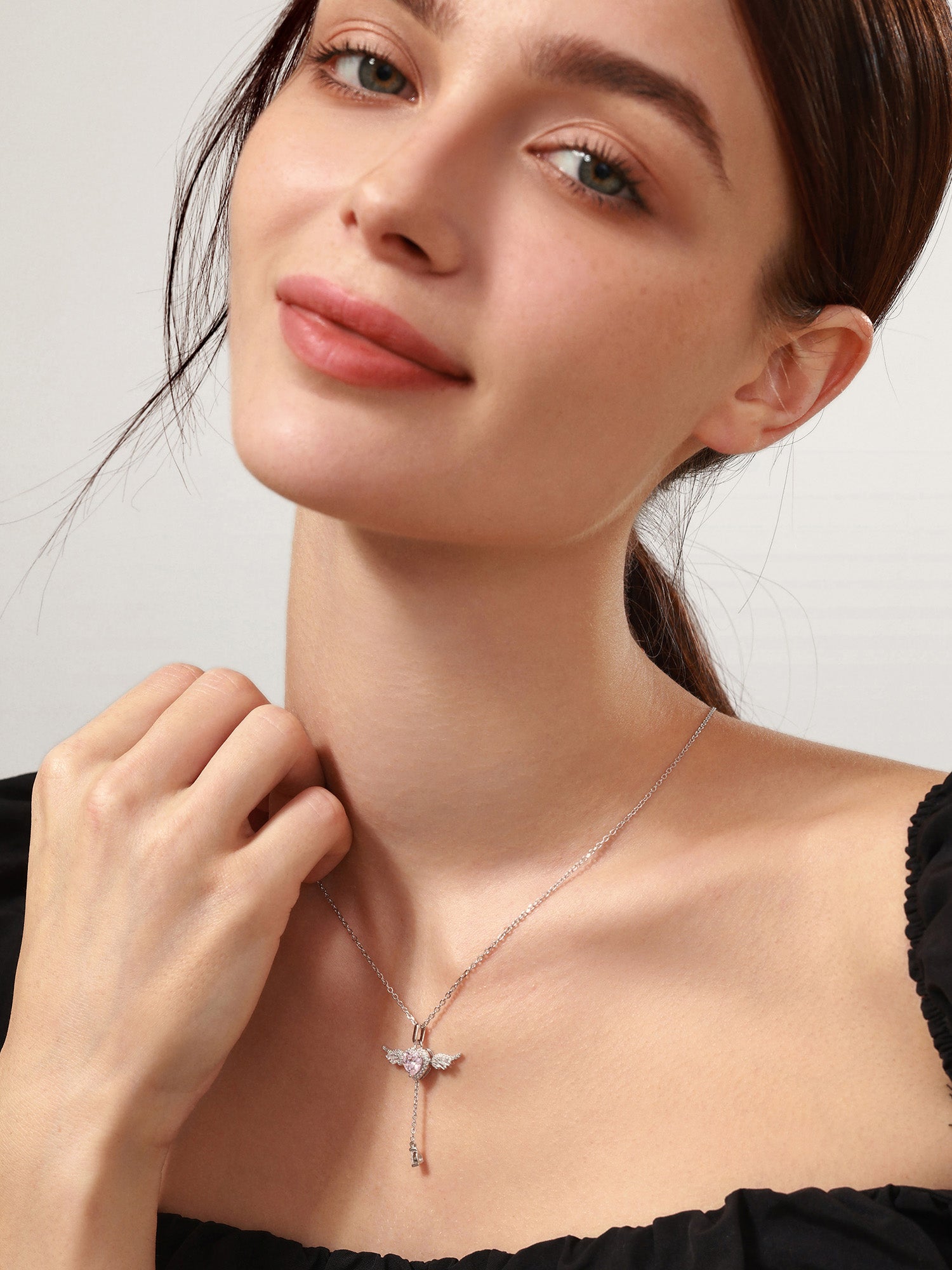 Sterling silver angel necklace, side angle view
