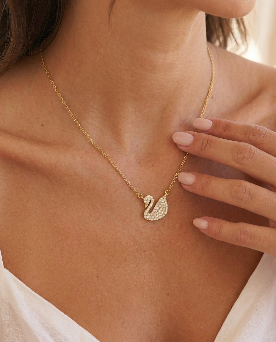 Sculptural gold swan pendant necklace with white zircon – Vessaly