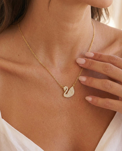Sculptural gold swan pendant necklace with white zircon – Vessaly