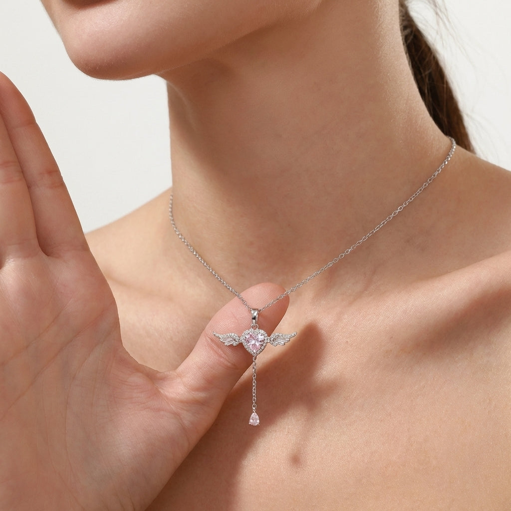 Close-up of silver angel pendant detail