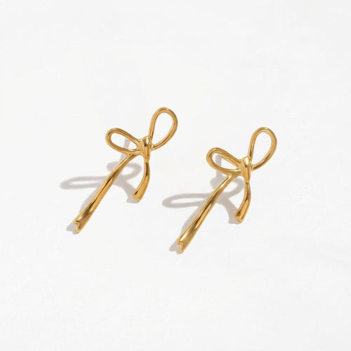 Wandering Bow gold drop earrings by Ravyena