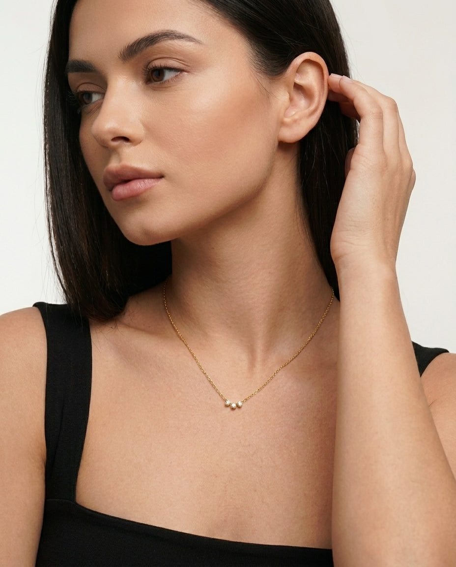 Gold Mika pendant necklace, side angle view