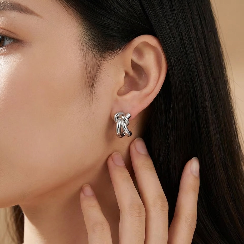 Knot huggie earrings stacked along the ear – Vessaly