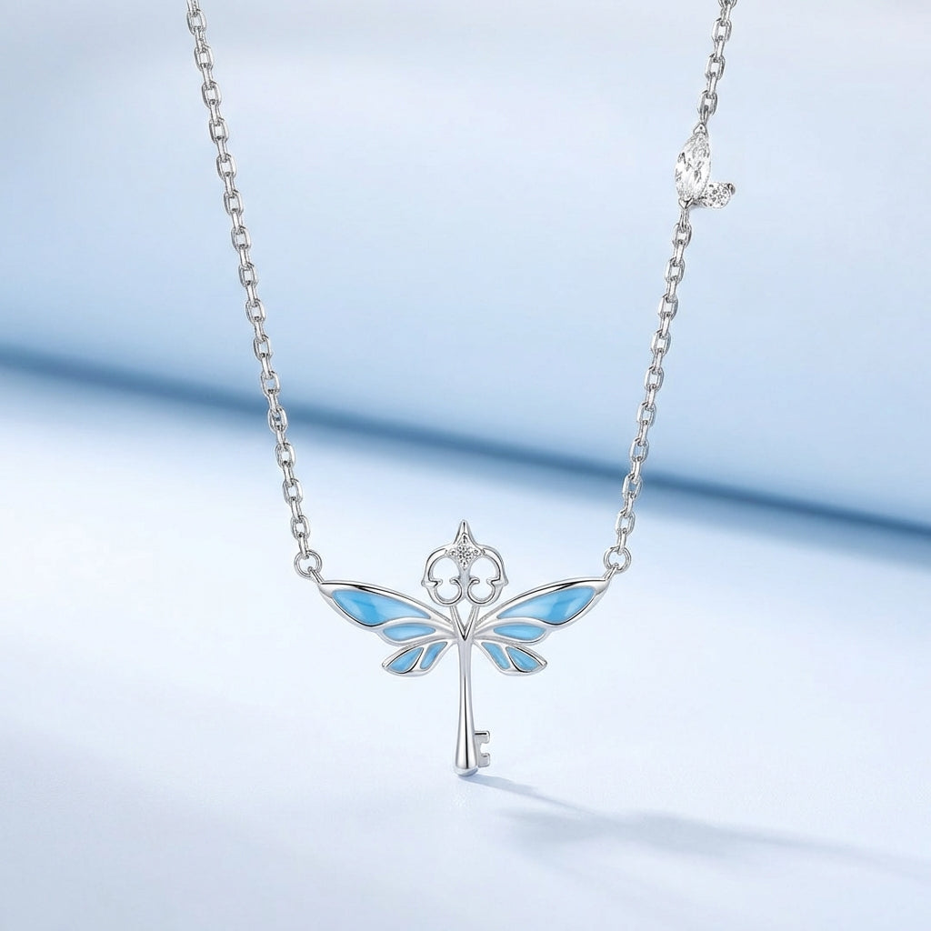 Close-up of winged key pendant detail – Vessaly