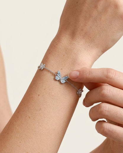 Starlight Butterfly enamel charm glowing in the dark