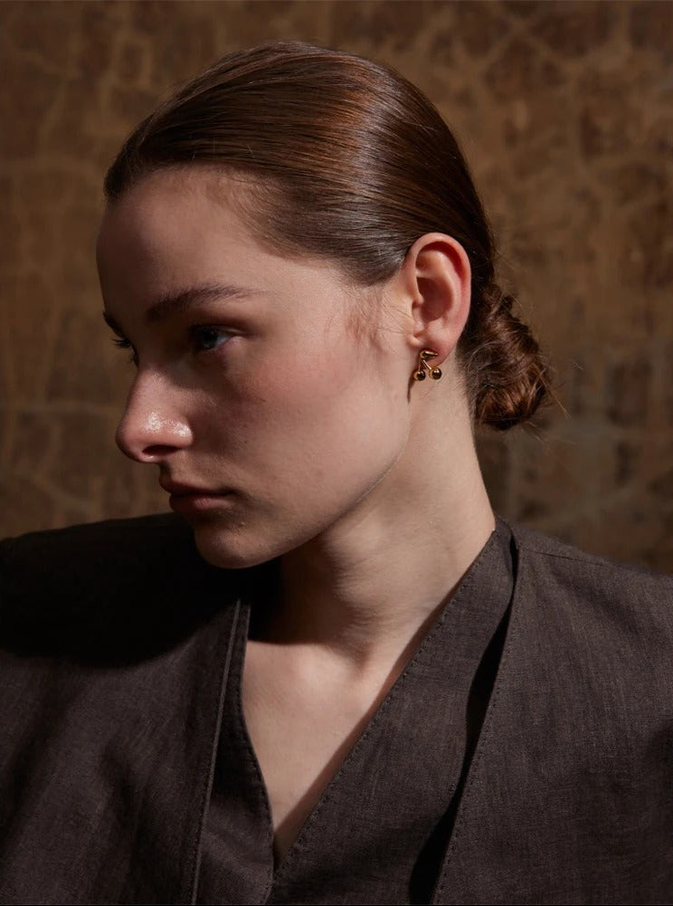 Polished cherry stud earrings detail – Vessaly