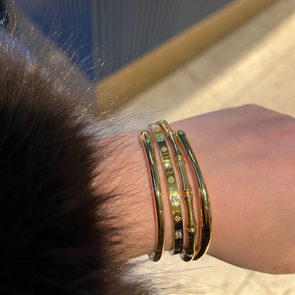 Star-set gold bangle worn on the wrist – Vessaly