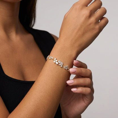 Sterling silver wisteria flower bracelet on a wrist
