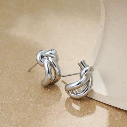 Silver knot huggie stud earrings, polished finish