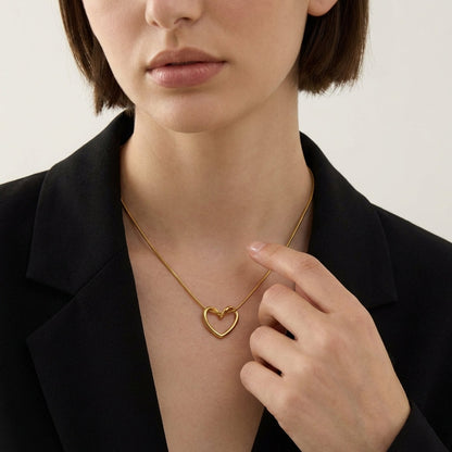 Open heart necklace styled on neckline – Vessaly