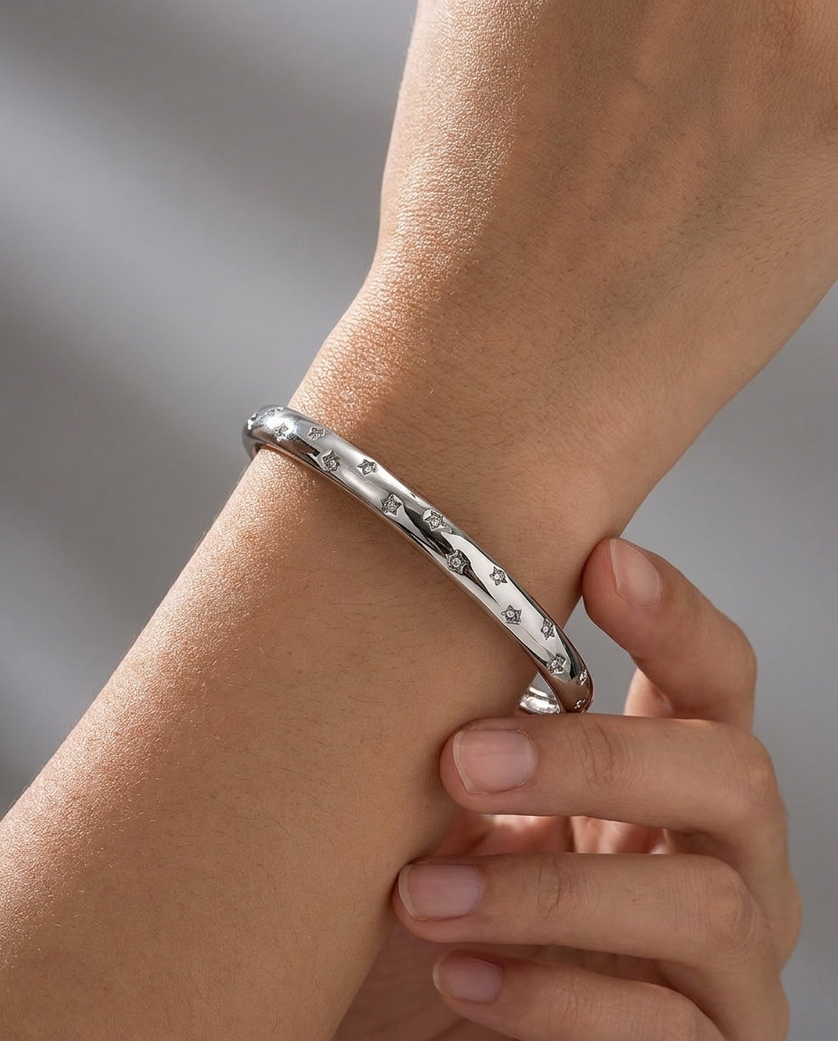 silver cuff bracelet with star set stones