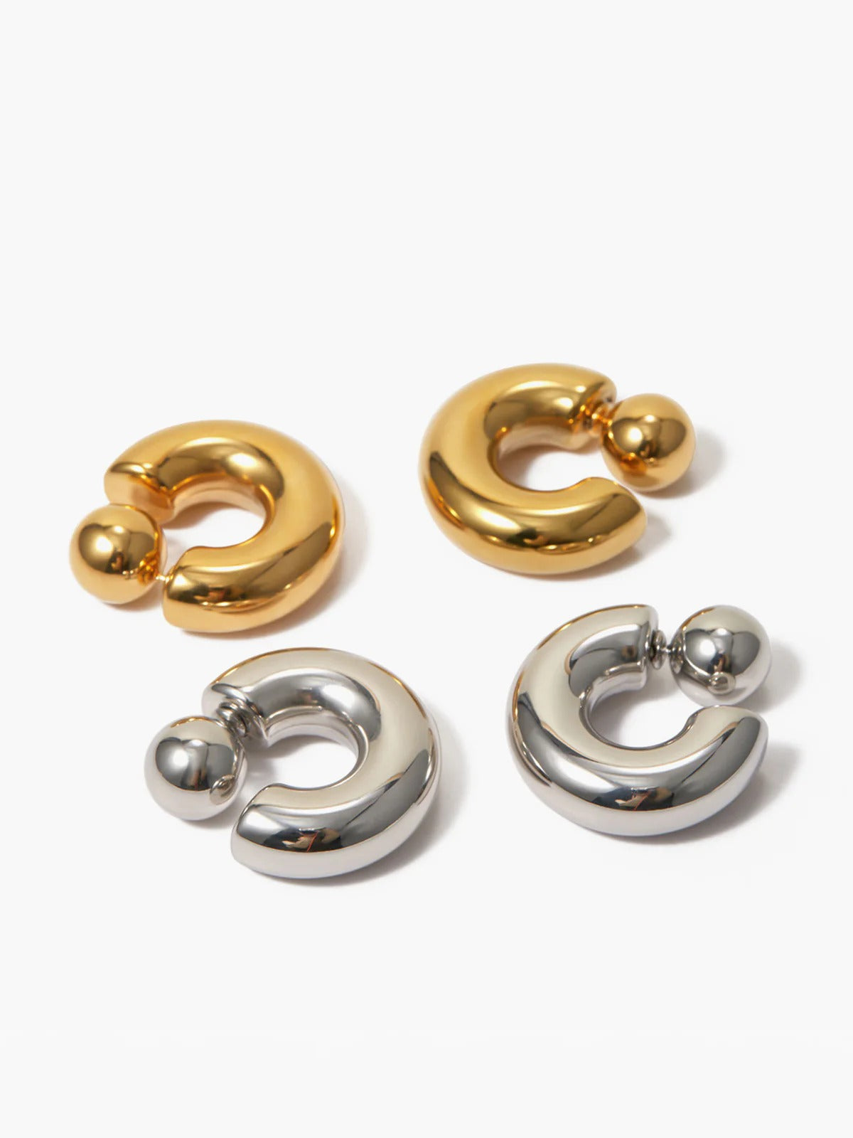 Chunky C-shaped hoop earrings — side angle, polished finish