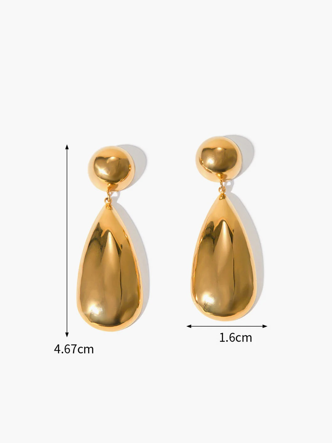 Close-up of gold goccia drop earring detail