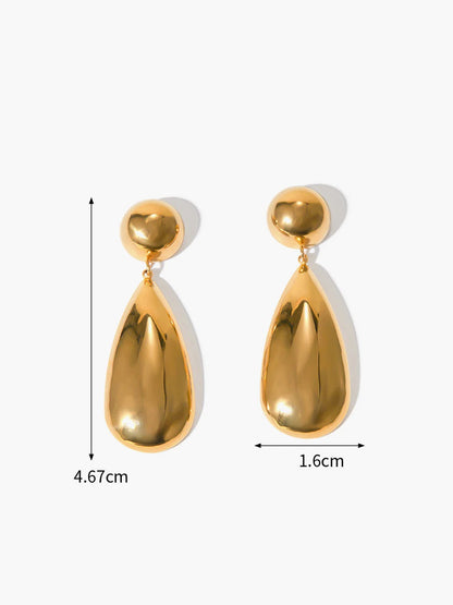 Close-up of gold goccia drop earring detail
