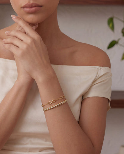 Chunky gold bangle worn on the wrist – Vessaly