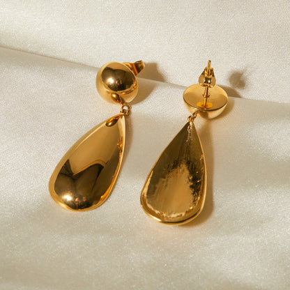 Goccia earrings styled on a model's ear