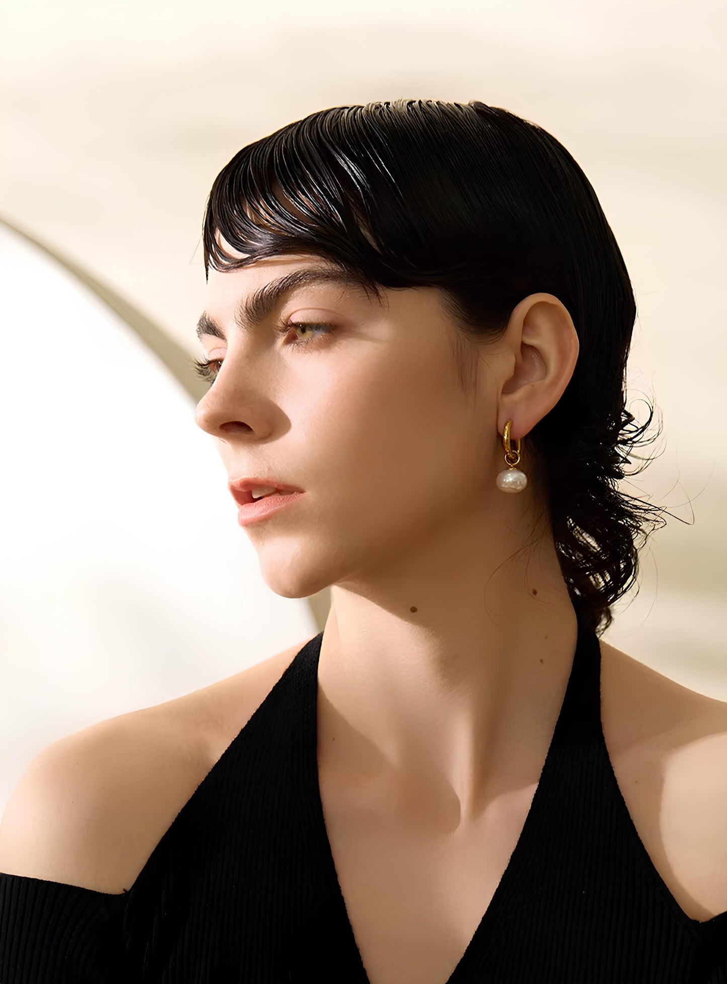 18K gold opaline earrings on neutral background