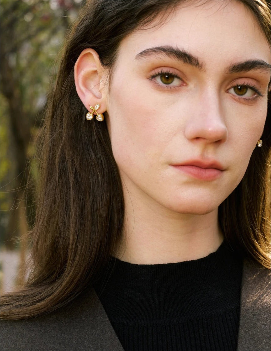Gold cherry stud earrings close-up detail – Vessaly