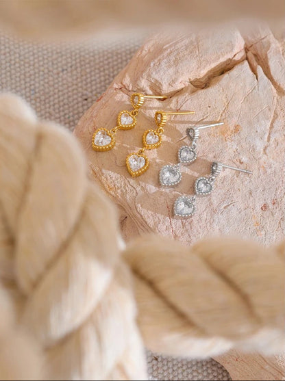 Trinity hearts earrings shown with elegant outfit