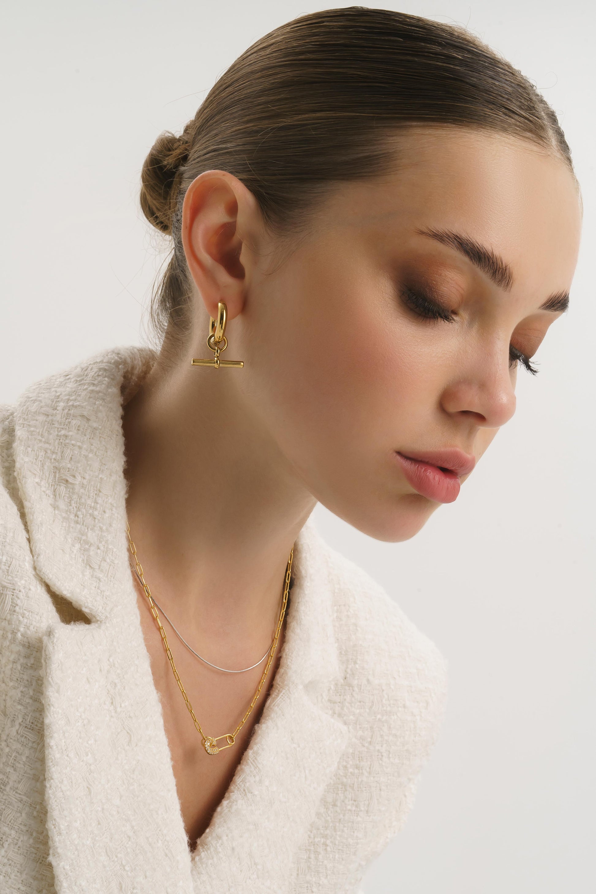 Modern gold T-bar hoops with smooth polished finish