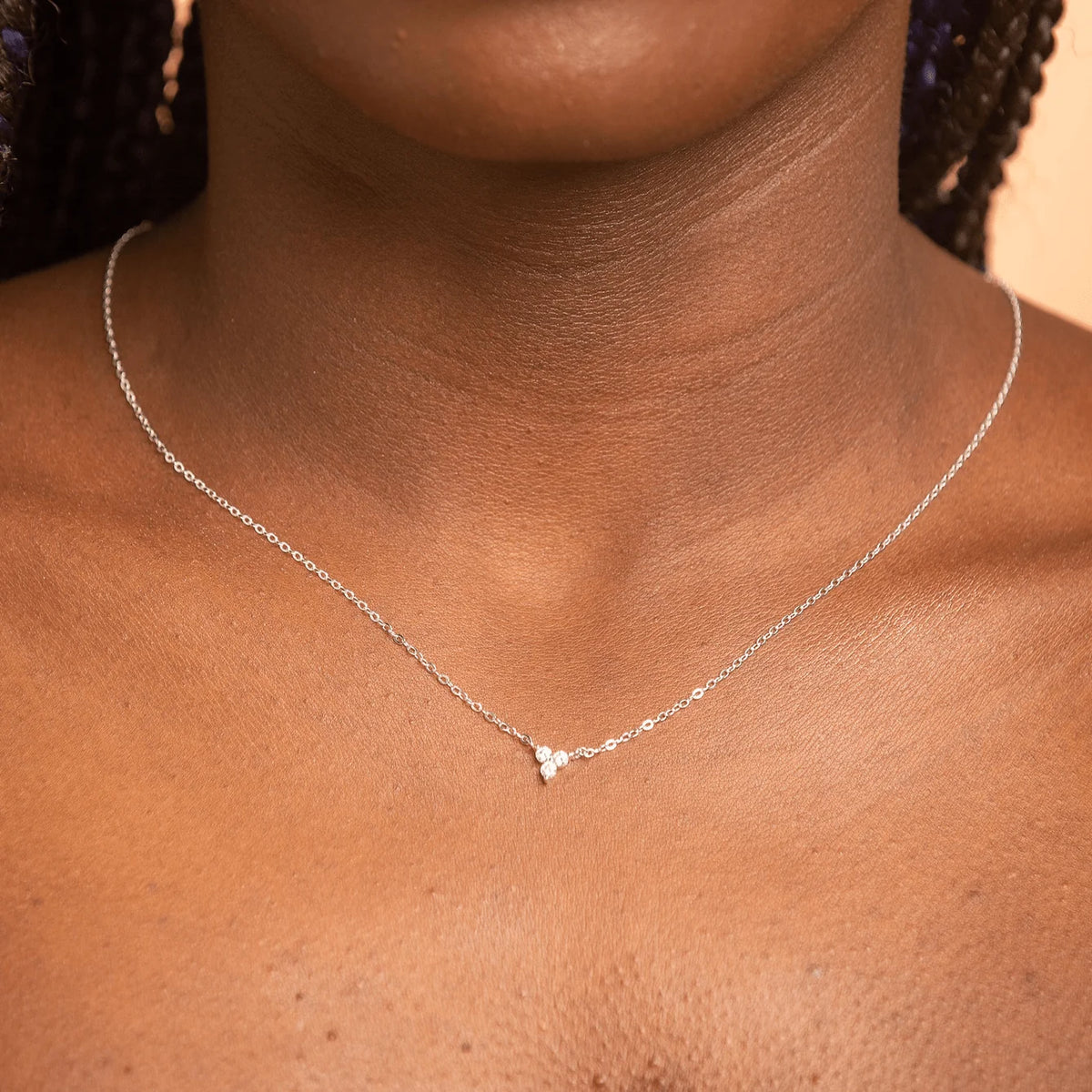 Lotus flower necklace styled on a model – Vessaly
