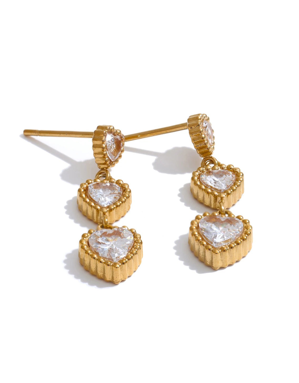 Trinity of Hearts earrings – flat lay presentation