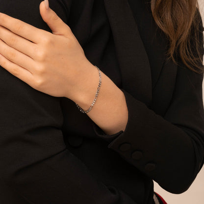 Figaro bracelet layered with a watch – Vessaly