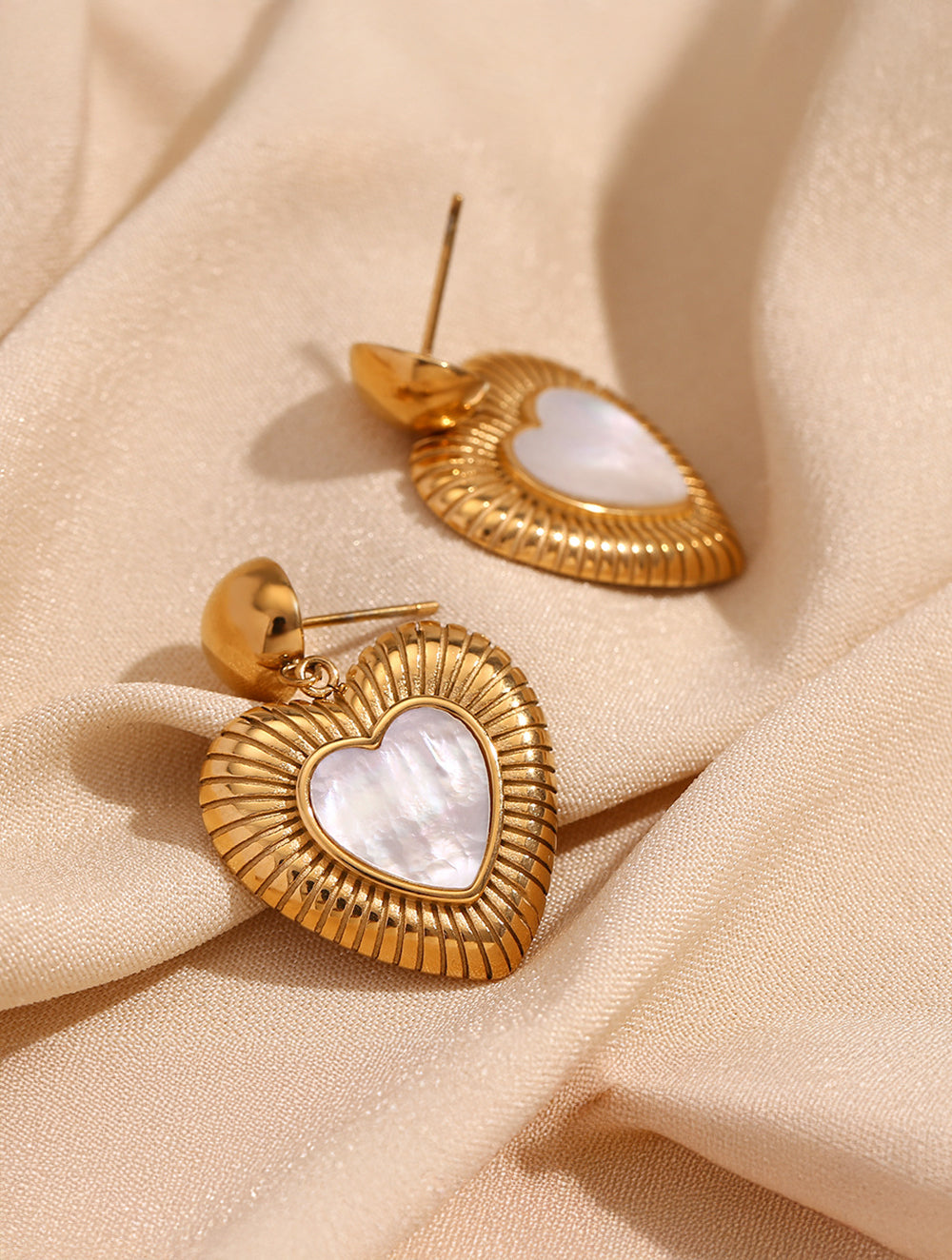Heartfall earrings, side angle view