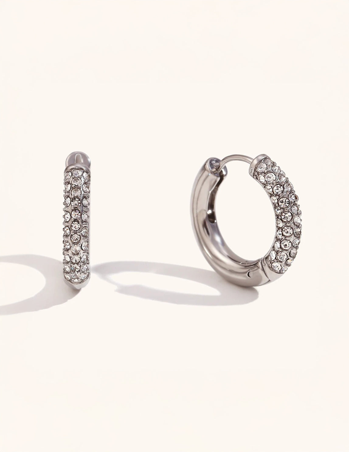 Halo Verge hoop earrings on neutral background — refined finish