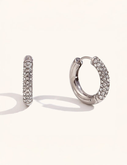 Halo Verge hoop earrings on neutral background — refined finish