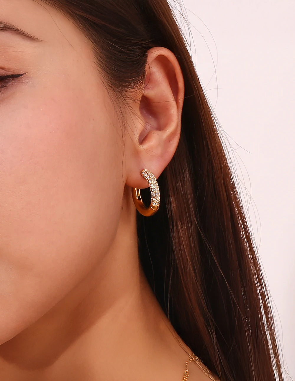Gold hoop earrings with zirconia accent — contemporary design