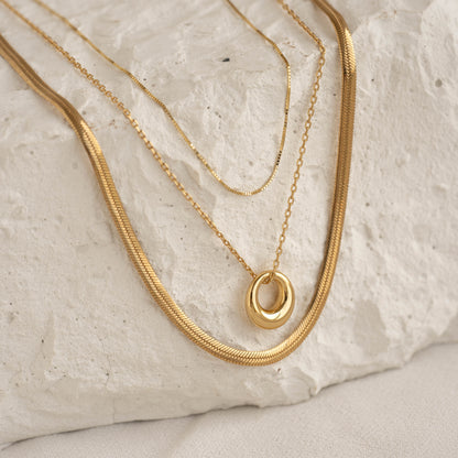 Gold circle necklace layered with delicate chains – Vessaly