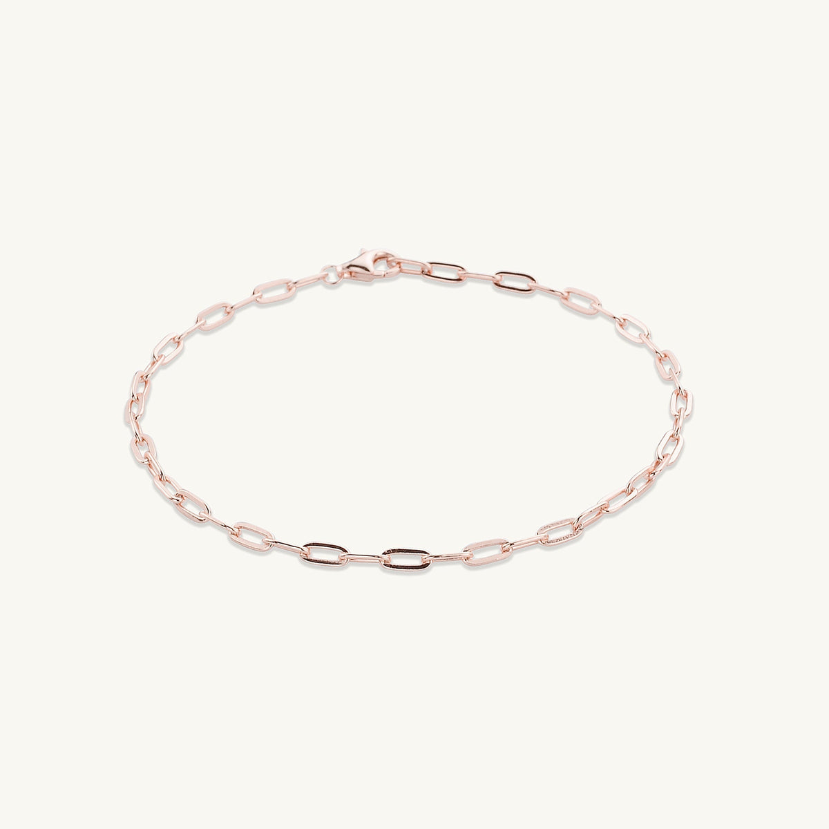 Gold chain bracelet shown with elegant outfit