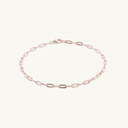 Gold chain bracelet shown with elegant outfit