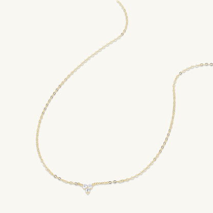 Lotus pendant necklace styled with an outfit – Vessaly