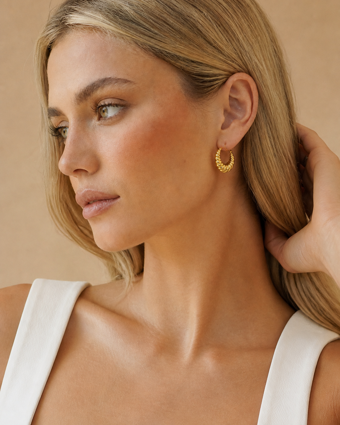 Nora 18K Gold-Plated Croissant Hoop Earrings worn by model profile view