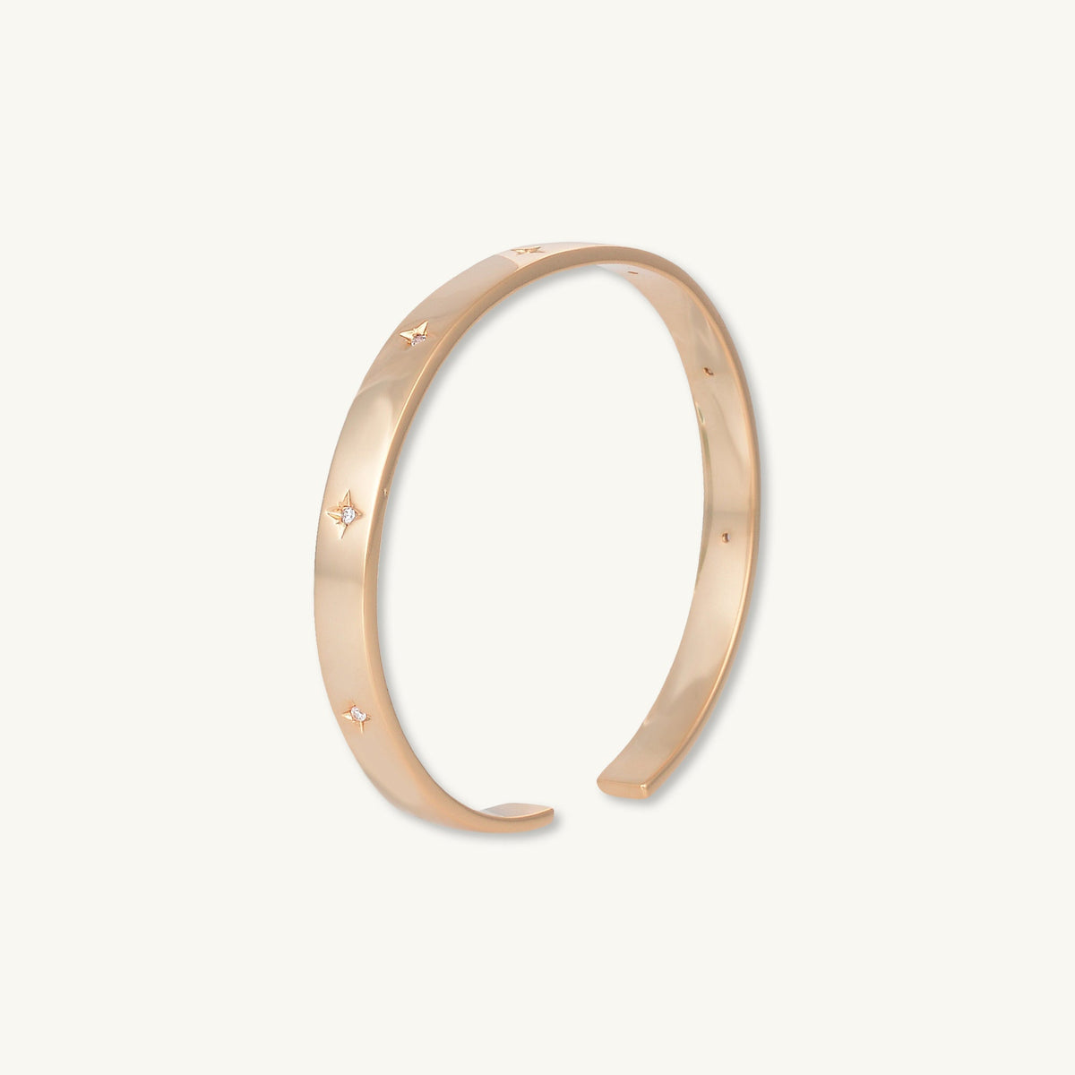 Gold bangle with star detail, alternative styling