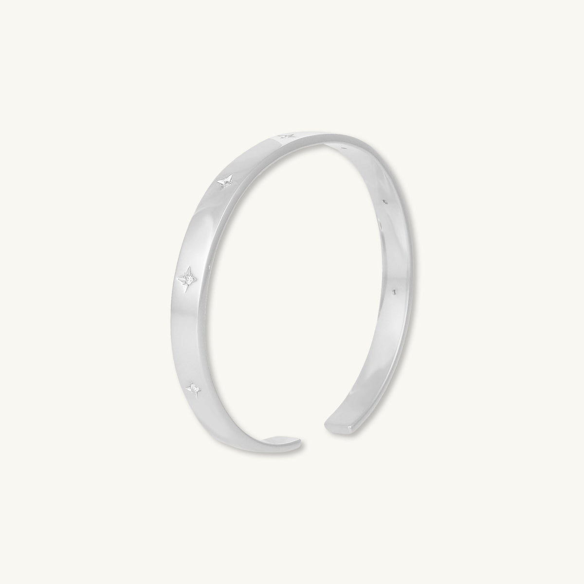 Star bangle bracelet shown in elegant outfit