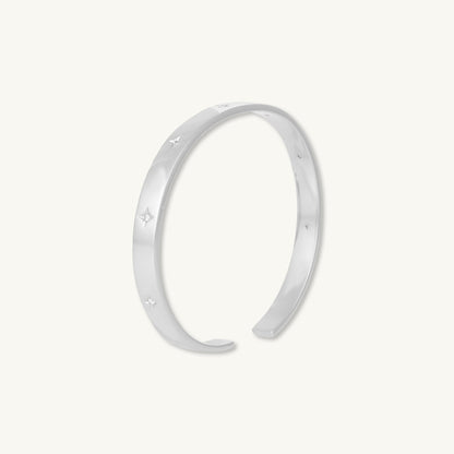 Star bangle bracelet shown in elegant outfit
