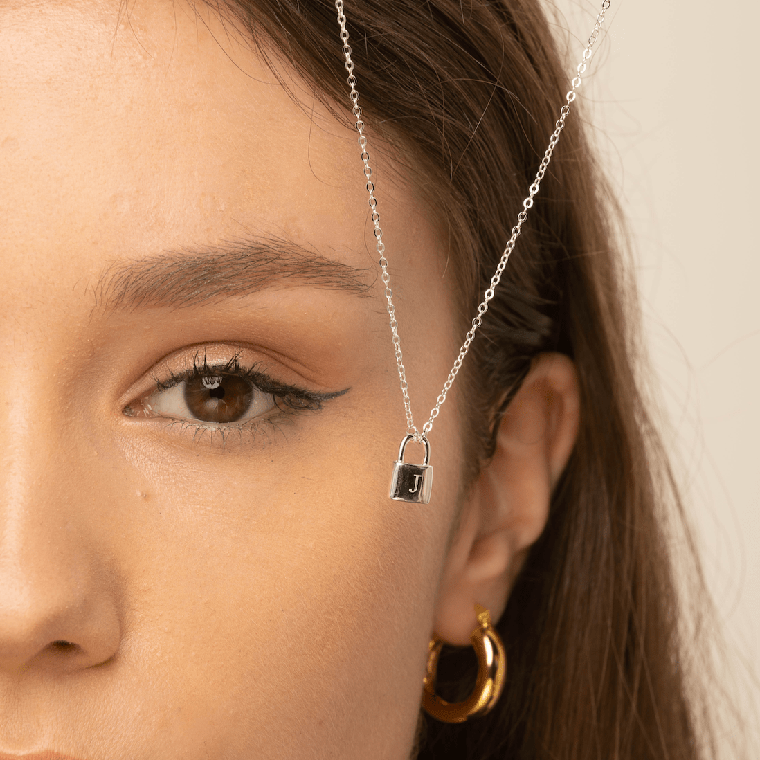 Padlock initial necklace layered with a longer chain – Vessaly