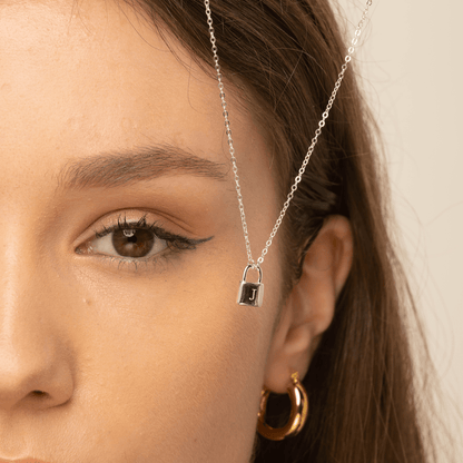 Padlock initial necklace layered with a longer chain – Vessaly