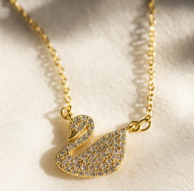 Gold swan necklace flat lay, 18K gold-plated pendant – Vessaly