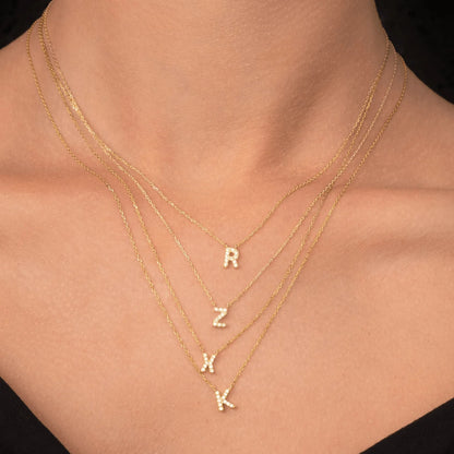 Sapphire letter pendant in gift packaging presentation